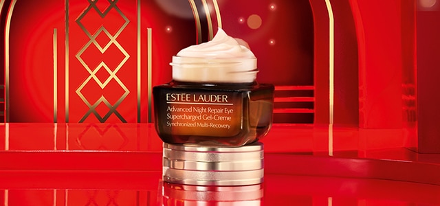 Advanced Night Repair Eye gel-creme bottle on red holiday background