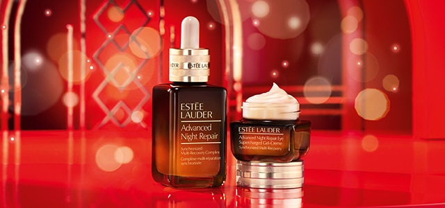 Advanced Night Repair Serum and Eye Gel-creme on red holiday background